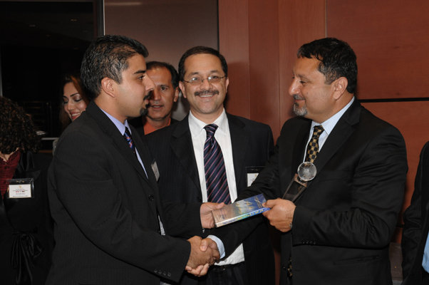 Rasheed Walizada presents his book to Ehsan Bayat 2006