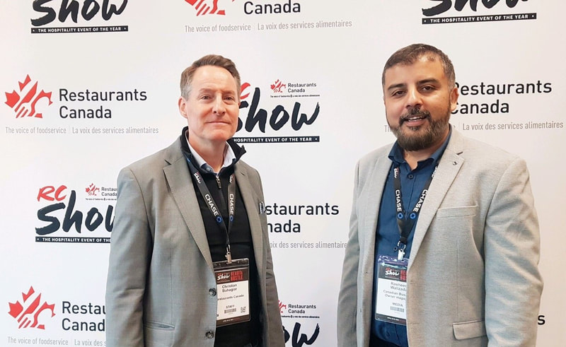 Rasheed Walizada with Christian Buhagiar President and CEO of Restaurants Canada at the RC Show Toronto